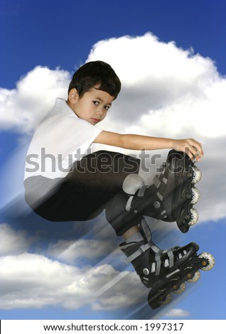 A young boy jumps high up in his roller blades into the sky.