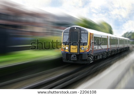 Very fast moving express train on the way into the city.
