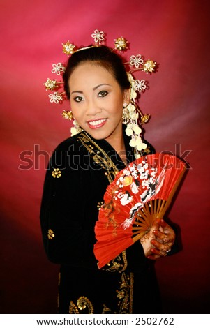 stock photo A Malay bride in her traditional Javanese costume