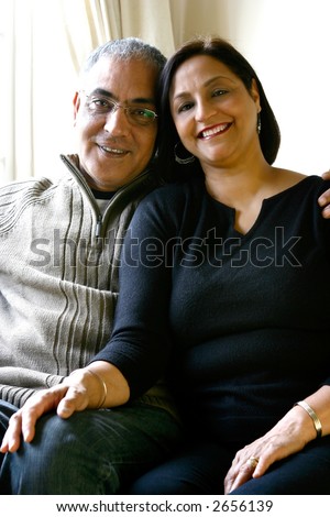 A happily married Asian couple relaxing together. Concept of marriage and love.