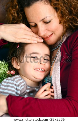 Beautiful mother and daughter of ethnic background enjoying some special moments together.
