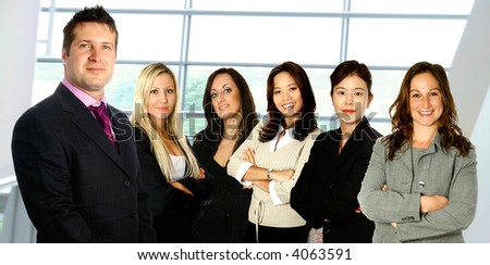 Male caucasian businessman leading a team of business women from diverse background made up of a caucasian, a mediterranean, an Asian and a Japanese woman,  isolated on white.