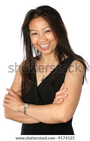 stock photo Beautiful mature Thai female in formal black dress appearing