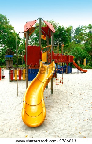 Playground equipment with slides and climbing frames for children.