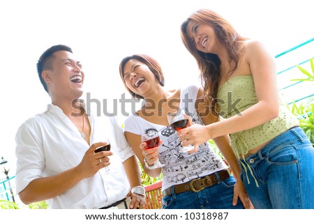 Three young friends enjoying time socializing together.
