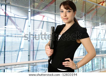 Young businesswoman or business representative in a modern corporate office building.