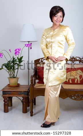 Malay woman in traditional \' Kebaya \' clothing with a modern style