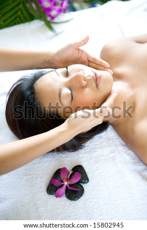 stock photo : Woman restful while having a facial therapy massage in spa