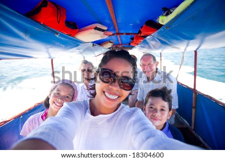 Happy family riding a fat boat going to an island.