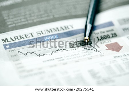 Pen on graph chart of falling stock market