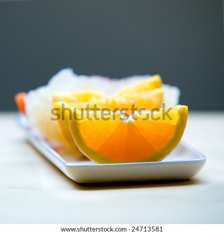 Slices of juicy oranges served on plate. Healthy fruit concept.