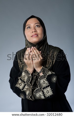 Muslim woman in traditional Islamic clothing made out of full suit covering the body and headscarf