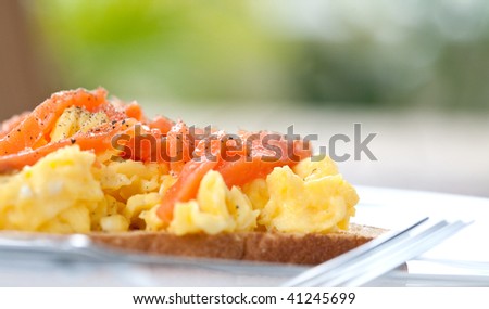 Smoke salmon with scrambled eggs on toast for breakfast
