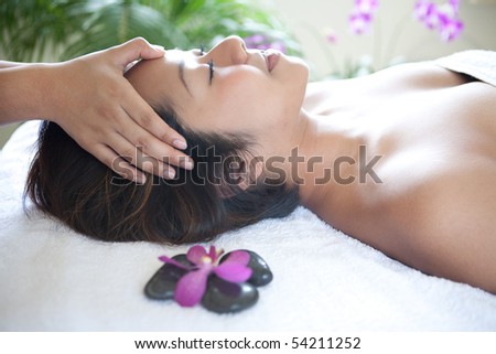 Young woman enjoying a massage day at the spa