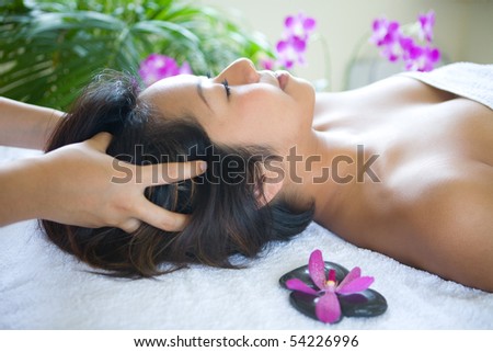 Young woman enjoying a massage day at the spa
