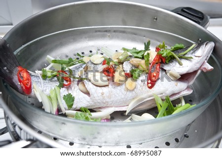 Fresh  Fish on Stock Photo   Fresh Sea Bass Fish With Oriental Ingredients Ready For