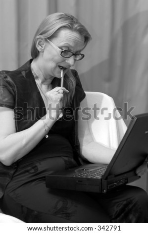 Middle aged women with laptop computer.