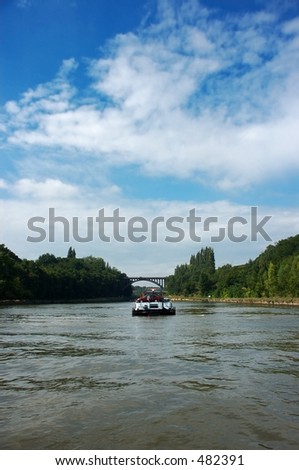 Transportation industry over the water, boat on river.