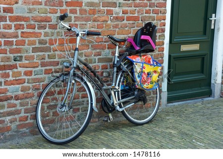 Typical dutch, holland colorful bicycle parked against a wall. Transportation, travel  concept.
