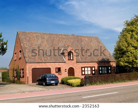 Rural suburban house  with garden, car parked in front. Summer period, sunny day. Real estate concept.