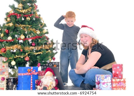 happy youngsters, teenage girl and  boy around Xmas, Christmas three with presents, gifts.  White background.