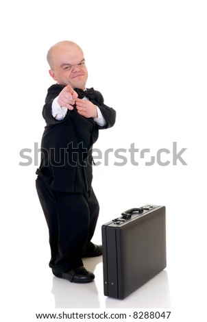 stock-photo-little-businessman-dwarf-in-a-formal-suit-with-bow-tie-next-suitcase-studio-shot-white-background-8288047.jpg