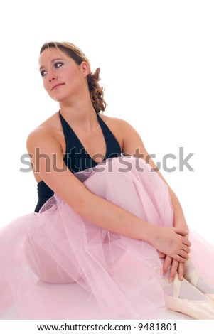Portrait of a dancing ballerina, ballet dancer. Studio shoot, white background, reflective surface