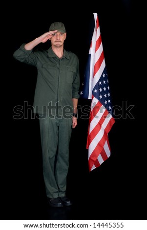 Attractive bearded middle aged man, soldier,  saluting american flag, studio shot, black background.
