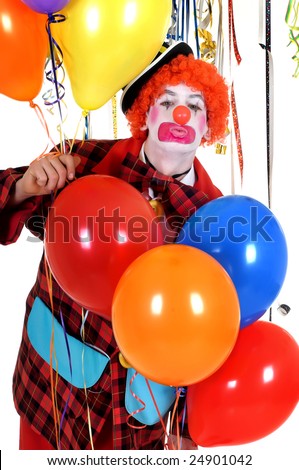 Colorful dressed male holiday clown with balloons, happy joyful expression on face. Studio shot.