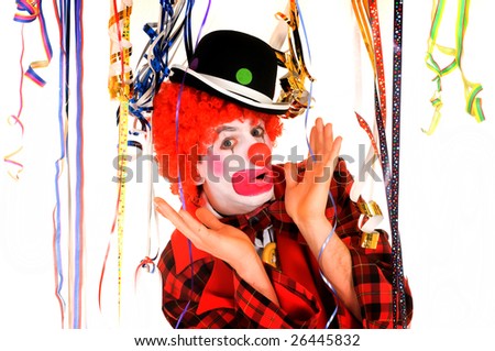 Colorful dressed male holiday clown, happy joyful expression on face. Studio shot.