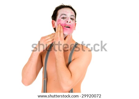 sad clown makeup. stock photo : Sad male clown showing emotion of pain and sorrow, removing makeup.