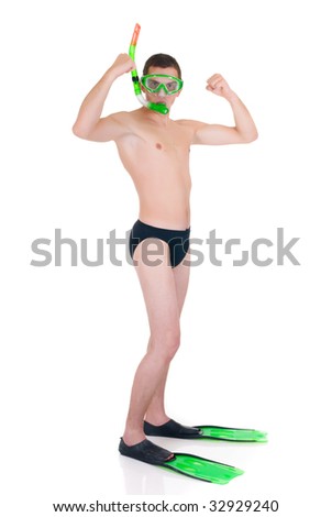 First swimming lessons for dummies, young man with snorkel, goggles and flippers.  Humorous studio shot.