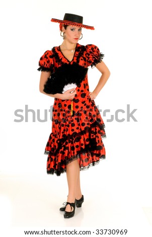 Attractive young female Spanish dancer with traditional outfit, studio shot, white background.