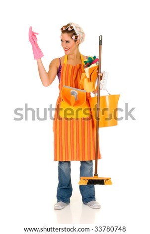 Attractive young housewife with curlers in hair and net on head, wearing colorful apron. Studio, white background
