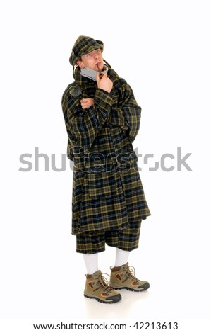 Young police officer dressed up as Sherlock Holmes investigating crime scene, white background