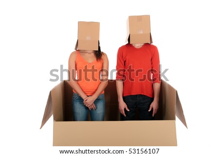 Young couple having quarrel during chat session, chat box, cardboard box representing chat room.  Studio, white background
