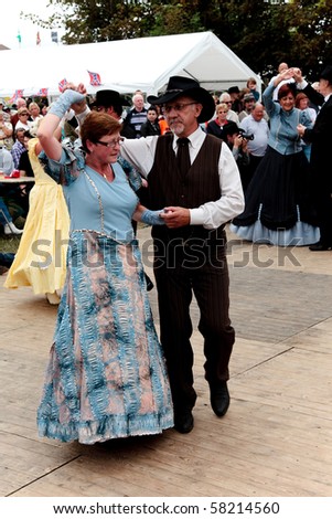 BREDENE , BELGIUM - JULY 31: Participants in the Country & Western sing/dance weekend wear traditional western outfits July 31, 2010 in Bredene , Belgium