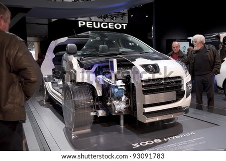 BRUSSELS, BELGIUM - JANUARY 12: Annual autosalon brussel 2012 auto motor show in Heysel  expo hall. Open Peugeot 3008 HYbrid4 concept car on display. January 12, 2012 in Brussels,  Belgium