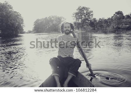 art image with handsome man in boat