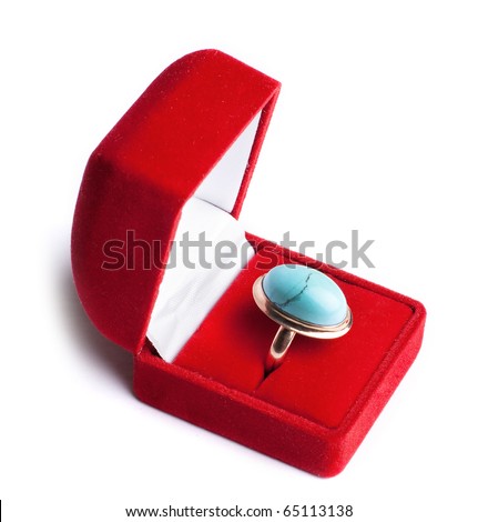 stock photo gold ring with turquoise in red box isolated on a white