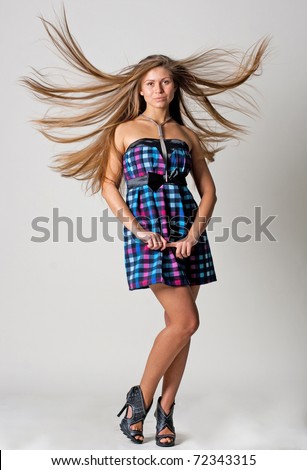 beauty young woman with good shape, and hairs on the wind