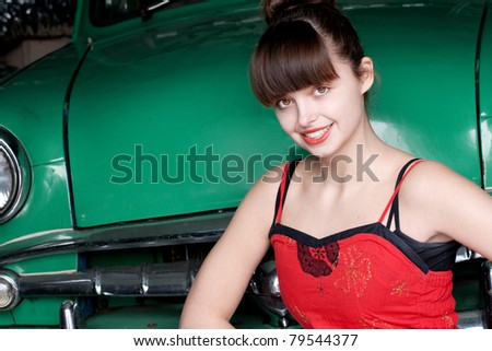 beauty young woman with green retro car, vintage