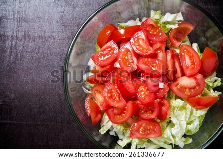 Healthy vitamin-rich salad of cherry tomato and Chinese cabbage. Top view