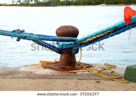 stock picture of ship ropes and structures to mooring the ship on the dock