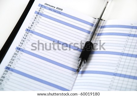 daily planner to keep appointments with a writing implement