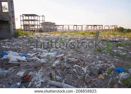 waste ground with the thrown building and plastic garbage