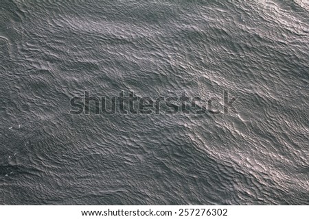 Unusual wave ripples on water cold Arctic sea. gust of heavy wind and ripples on water. View from top. Kara sea.