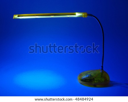 The included light-emitting diode lamp on a dark blue background