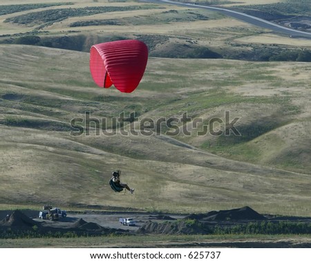 red paraglider solo