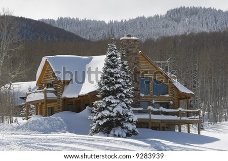 cabin in snow in mountains